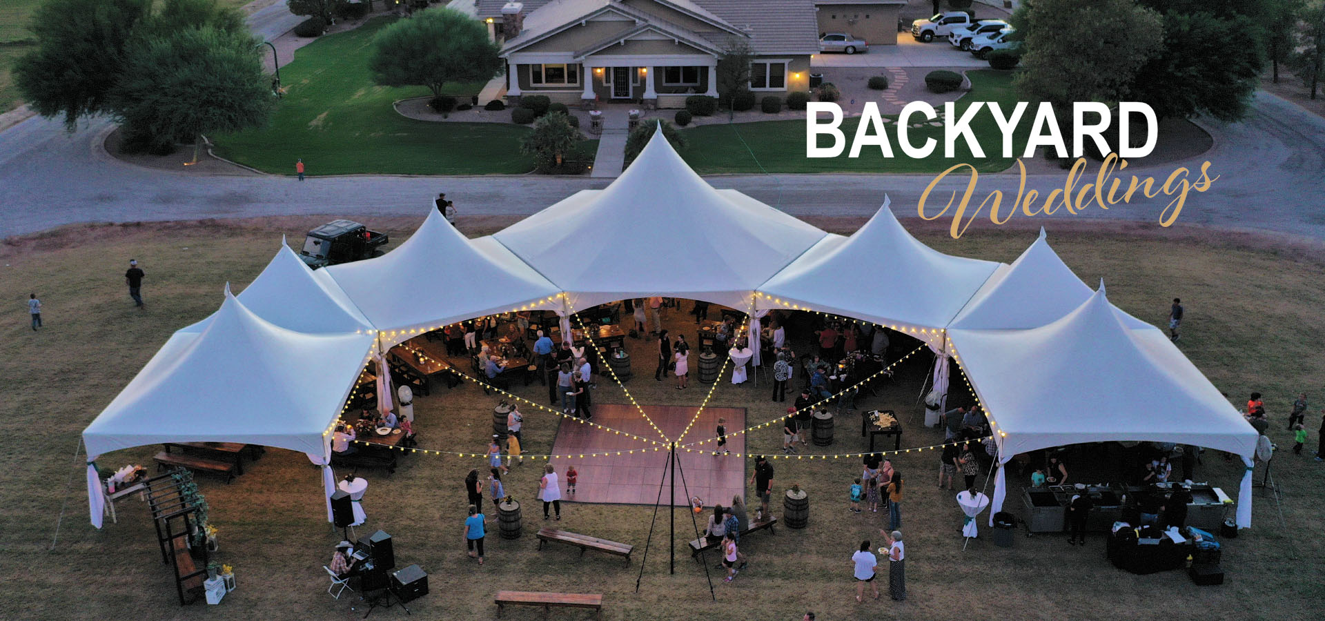 Full backyard wedding rental package with a large tent configuration, outdoor lighting, a dance floor, tables, chairs, linens, and party lights.