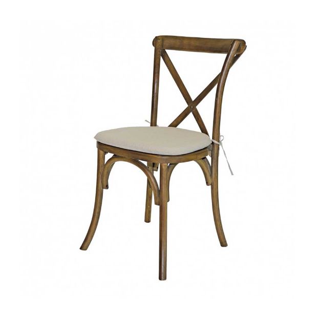 Side view of an wood X-Back rental chair with optional cushion against a white background.