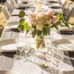 Ivory linen napkins elegantly placed on a wedding guest table.
