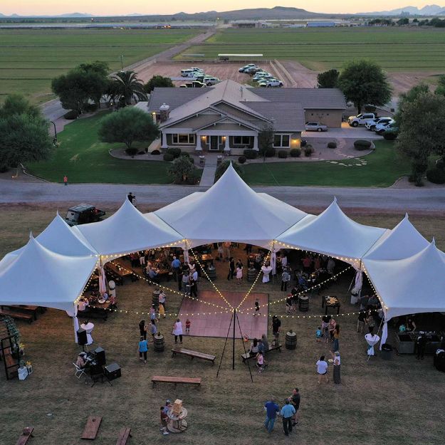 Dancing Under the Stars 250 guest wedding package with aerial shot of a reception in progress.