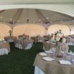 Dancing Under the Stars wedding tent package set up with tables, chairs and linens before a wedding reception.