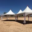 Dancing Under the Stars Mini Canopy with leg drapes prior to installing artificial turf on the dirt surface.