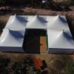 Aerial view of a Dancing Under the Stars 520 Wedding Tent configured with twinkle lights and a dance floor.