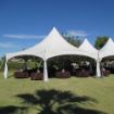 Diamond Hexagon Package decorated for a large backyard wedding with twinkle lights and guest tables.