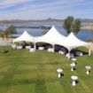 Beautiful lake wedding configuration with a Hexagon 125 wedding rental package and Lake Pleasant in the background.