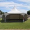 Our most popular Hexagon Wedding Tent canopy with decorative leg drapes and cardinal colored ties.