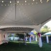 G40 lighting and tent leg drapes set the stage for and epic party inside a 20' x 60' Rectangle wedding tent.