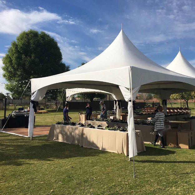 JMS Crew setting up for a party in a Dancing Under the Stars 320 Wedding Tent Rental Package.