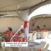 White tent pole leg drapes installed with colorful fabric ties on a rental tent.