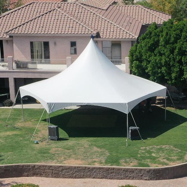 Matrix Marquee Hexagon Canopy Tent set up on the grass in a backyard.