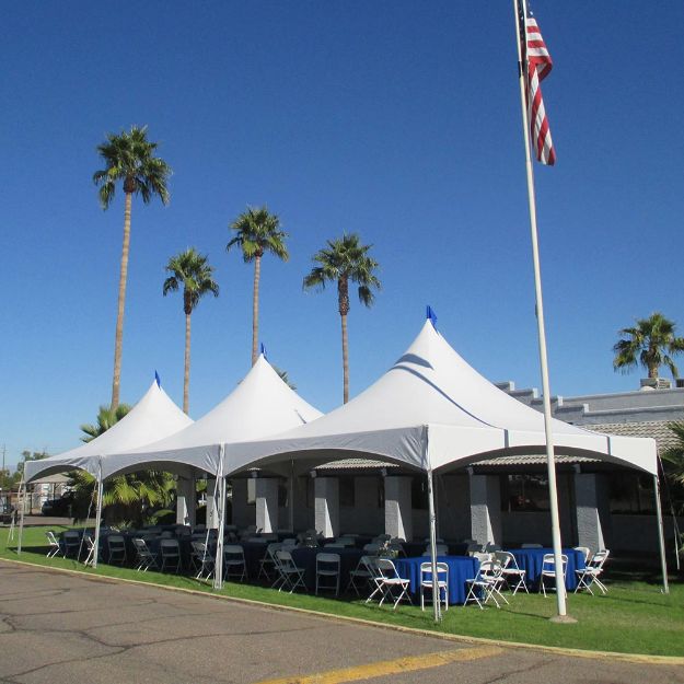 Large 20' x 60' Matrix Rental Tent set up on the grass in front of a corporate building.