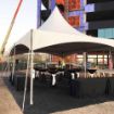With a crane in the background a fully configured Groundbreaking Tent Rental package is ready for a celebration.