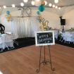 Dance floor under a 20' x 20' rental tent canopy prior to a 70th wedding anniversary celebration.