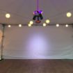 Globe and dance lights shown under a backyard dance tent package with a dance floor below.