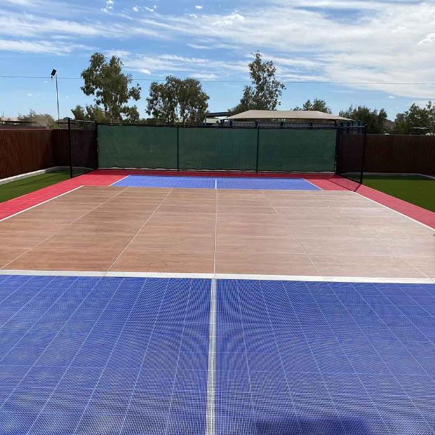 24' x 24' dance floor set up on a backyard basketball court.