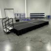 8' x 16' modular event stage with two 4' x 8' decks connected show from behind a podium setup for an event.